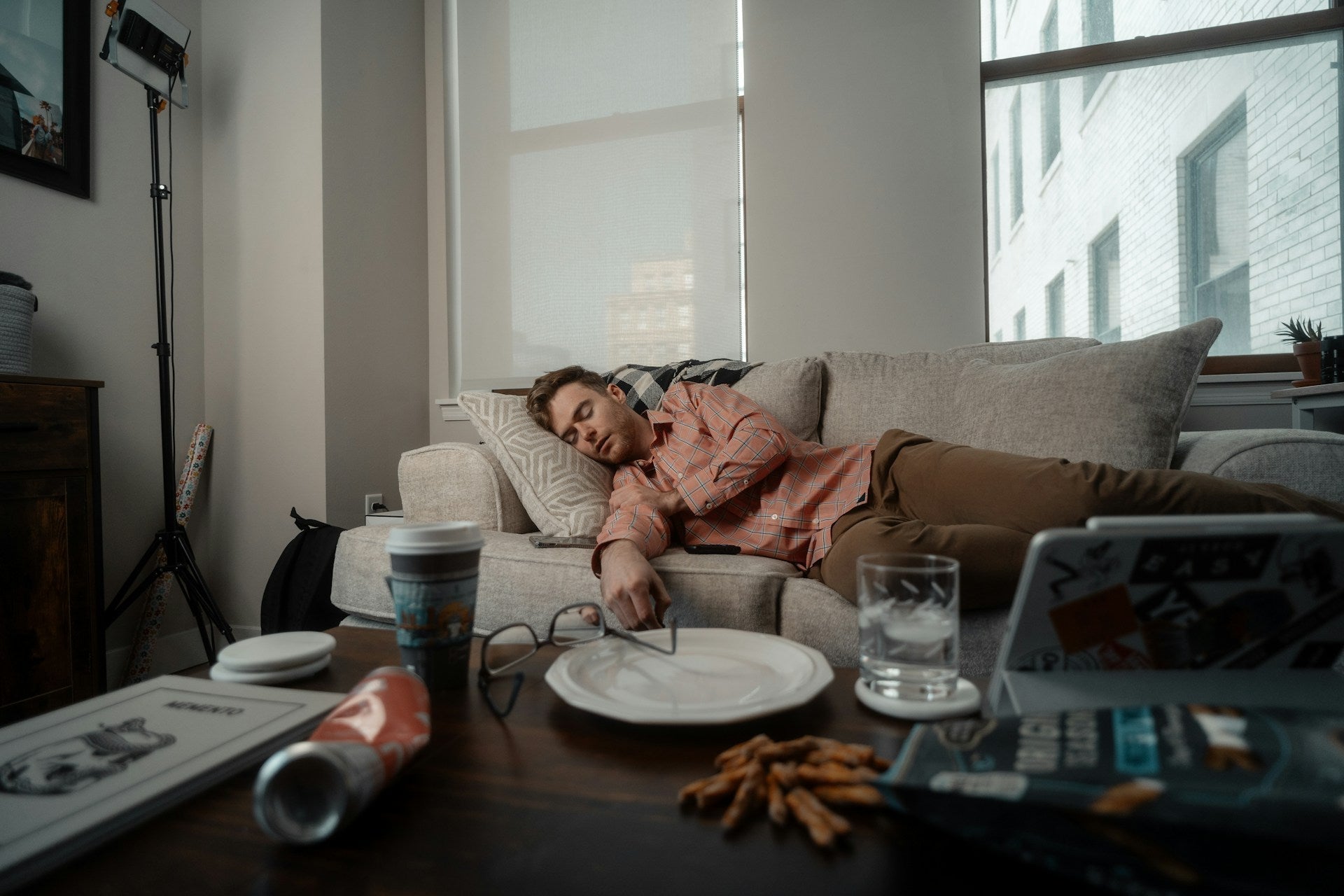 man who has fallen asleep after procrasturbating his work