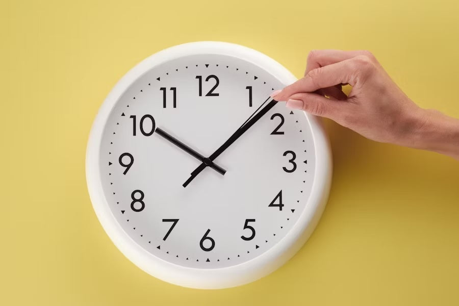 A clock pointing at 10:12. A good time to masturbate