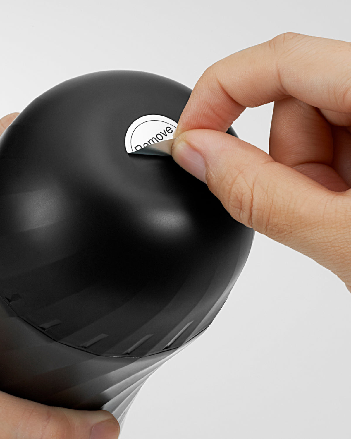 Removing the TENGA AIR-TECH TWIST cap and air hole Sticker